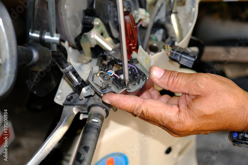 Motorcycle repair technicians check the wiring or repair of the motorcycle.