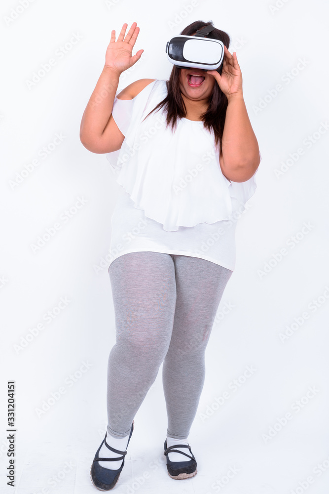 Beautiful overweight Asian woman against white background Beautiful overweight Asian woman against white background