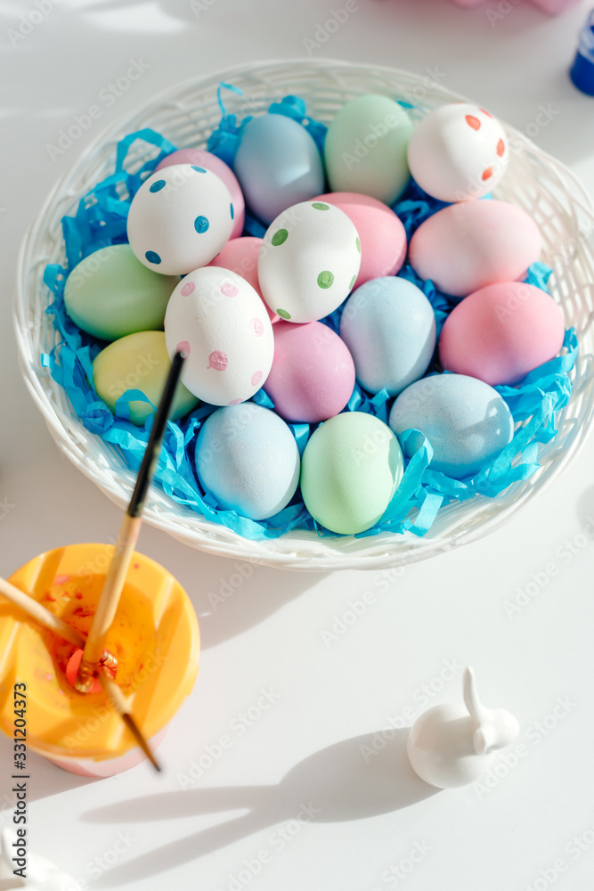 top view of painted easter eggs near decorative bunny top view of painted easter eggs near decorative bunny