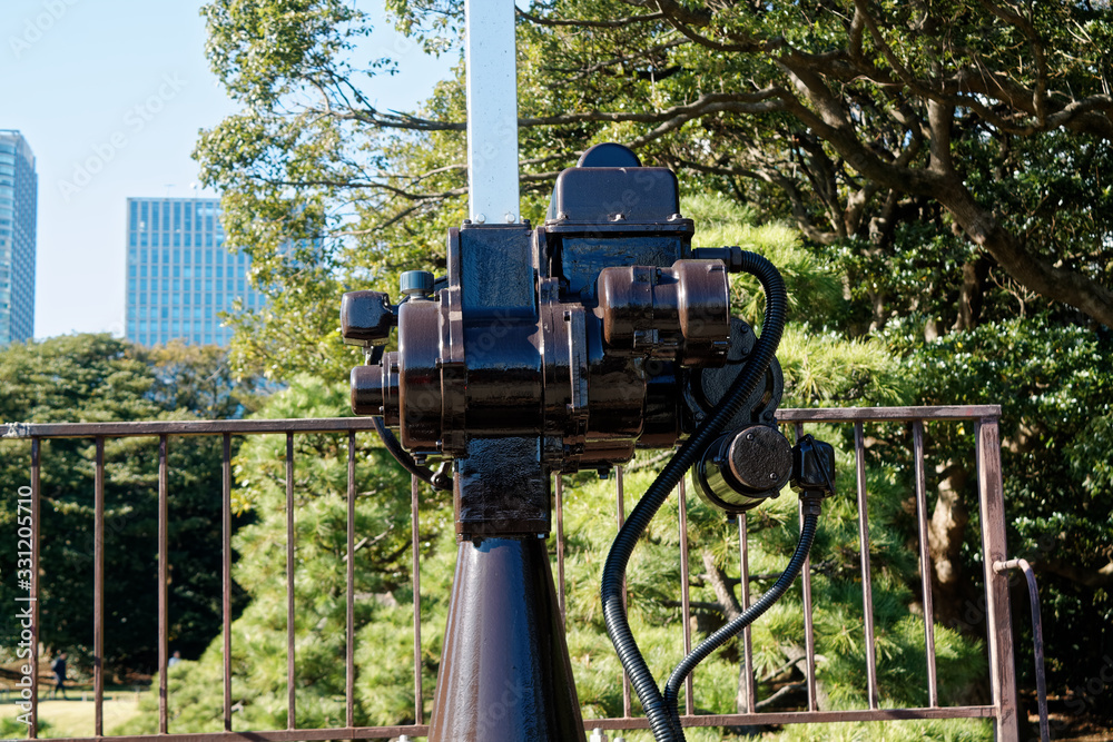 Old and rusty mechanism consisting of gears shafts and gears standing at the base of the bridge Old and rusty mechanism consisting of gears shafts and gears standing at the base of the bridge