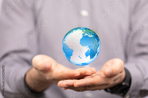 Human Hand Holding The World In Hands.
