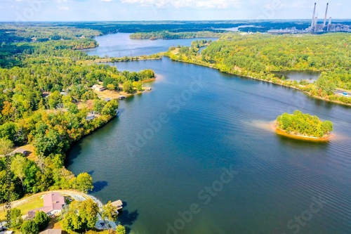 Aerial shot of Belews Lake in North Carolina, USA with a small island, houses, powerplant photo