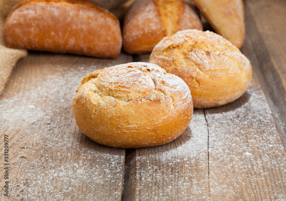 fresh buns on wooden background fresh buns on wooden background