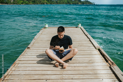 man with fresh coconut