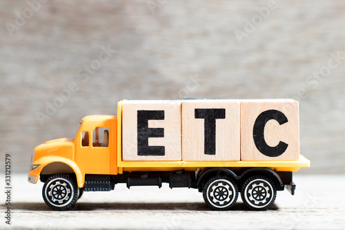 Принти на полотні Truck hold letter block in word etc (abbreviation of et cetera) on wood backgrou