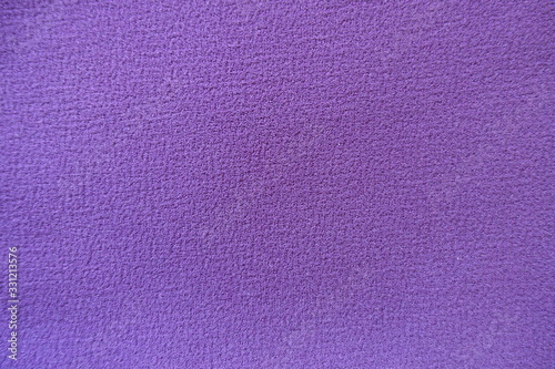 View of simple purple polyester fabric from above