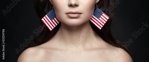 Beautiful young woman with american flag earrings