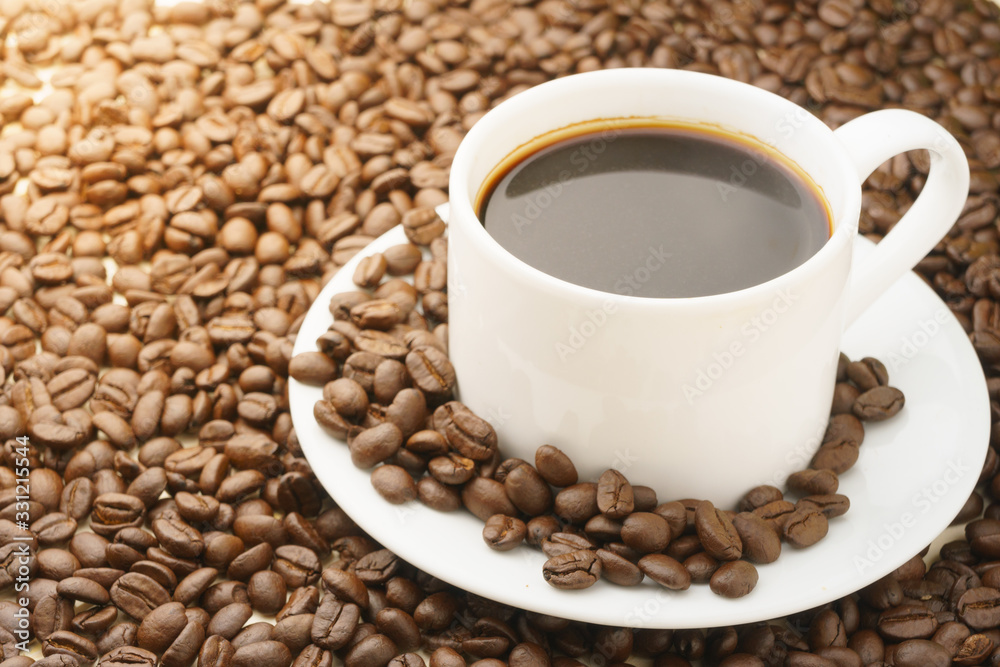 coffee cup with coffee beans. free copy space for your text coffee cup with coffee beans. free copy space for your text