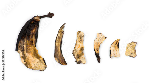 Decaying banana slices against white background