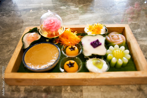 Nine auspicious thai desserts and many sweets snacks thai style for travelers people eating at restaurant cafe