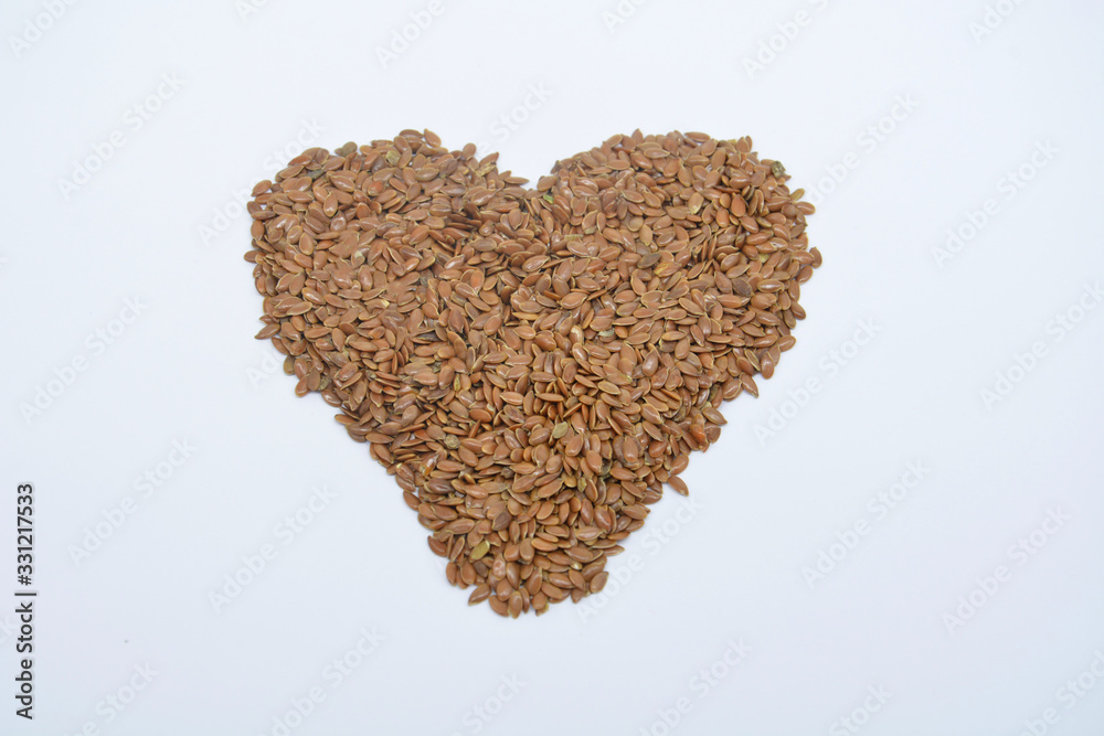 Linum usitatissimum is scientific name of Brown Flax seed. Also known as Linseed, Flaxseed and Common Flax. Pile of grains Linum usitatissimum is scientific name of Brown Flax seed. Also known as Linseed, Flaxseed and Common Flax. Pile of grains