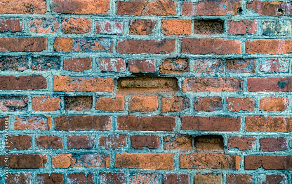 Fototapeta premium Old cracked red brick wall