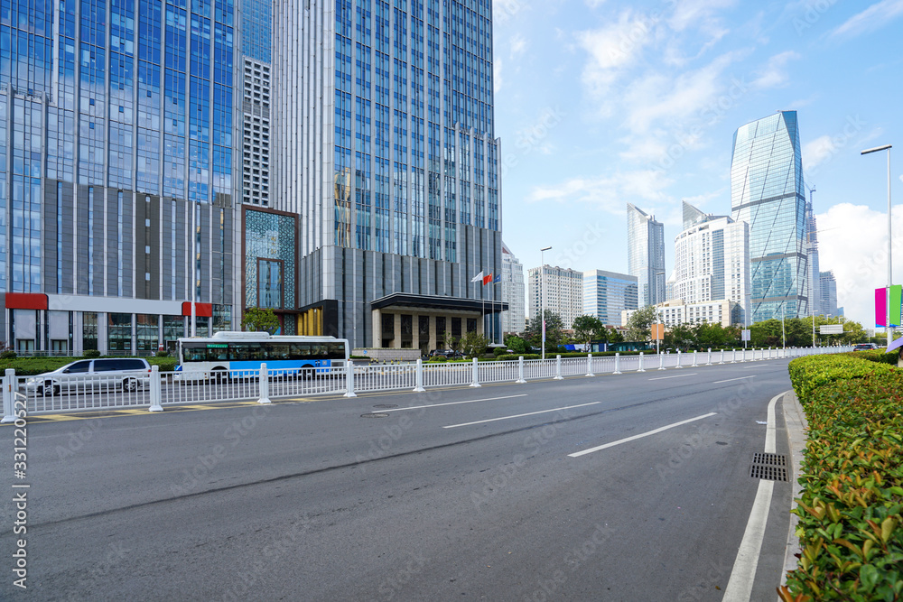 empty highway with cityscape and skyline of qingdao,China.