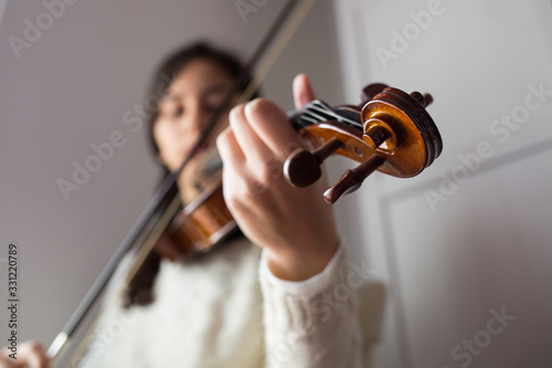 Young student violinist practice at home