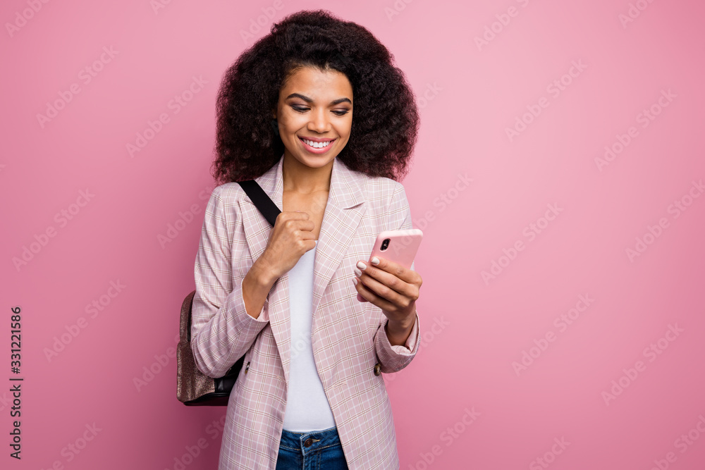 Photo of beautiful funny dark skin lady hold telephone writing new blog post comment walk lessons college with backpack wear plaid blazer jeans isolated pastel color background Photo of beautiful funny dark skin lady hold telephone writing new blog post comment walk lessons college with backpack wear plaid blazer jeans isolated pastel color background