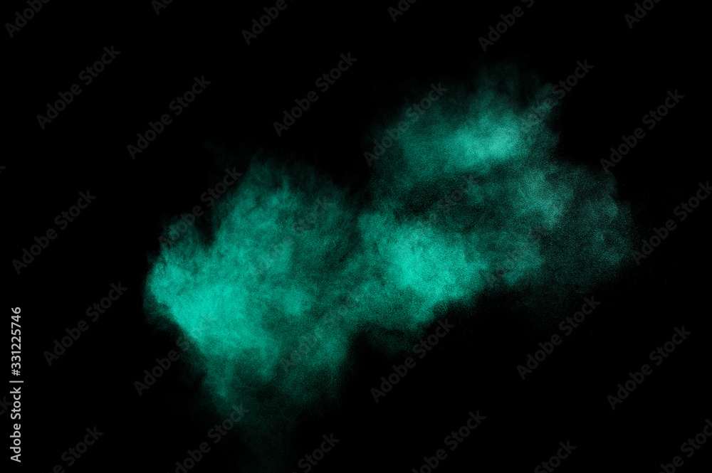 Aquamarine powder explosion on black background. Colored powder cloud. Colorful dust explode. Paint  Holi.