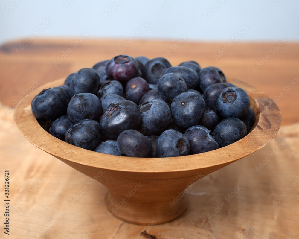 A studio photograph of a bowl of blueberries A studio photograph of a bowl of blueberries