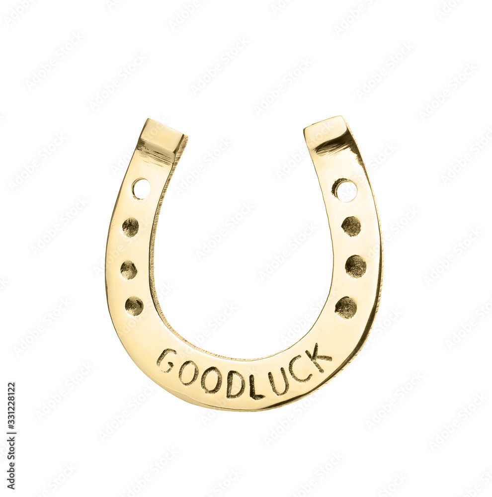 Golden horseshoe with phrase GOOD LUCK isolated on white. St. Patrick's Day celebration Golden horseshoe with phrase GOOD LUCK isolated on white. St. Patrick's Day celebration