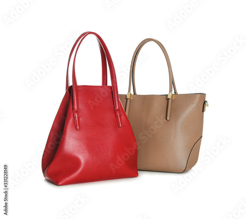 Different stylish woman's bags isolated on white