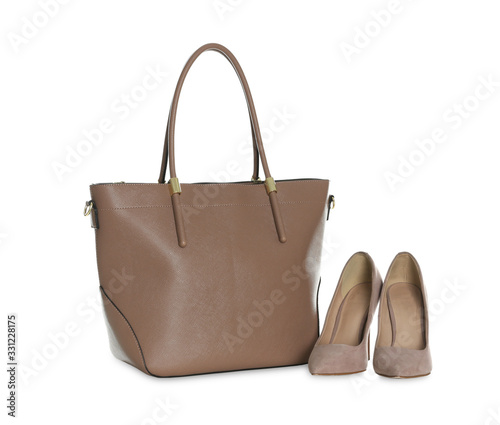 Stylish woman's bag and shoes isolated on white