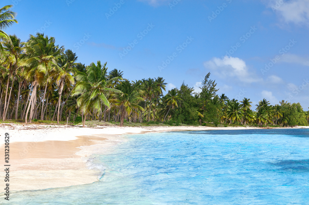 Tropical island. Desert island. Pure white sand. View of the beach from the water.