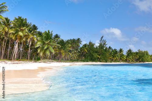 Tropical island. Desert island. Pure white sand. View of the beach from the water. © Baranov