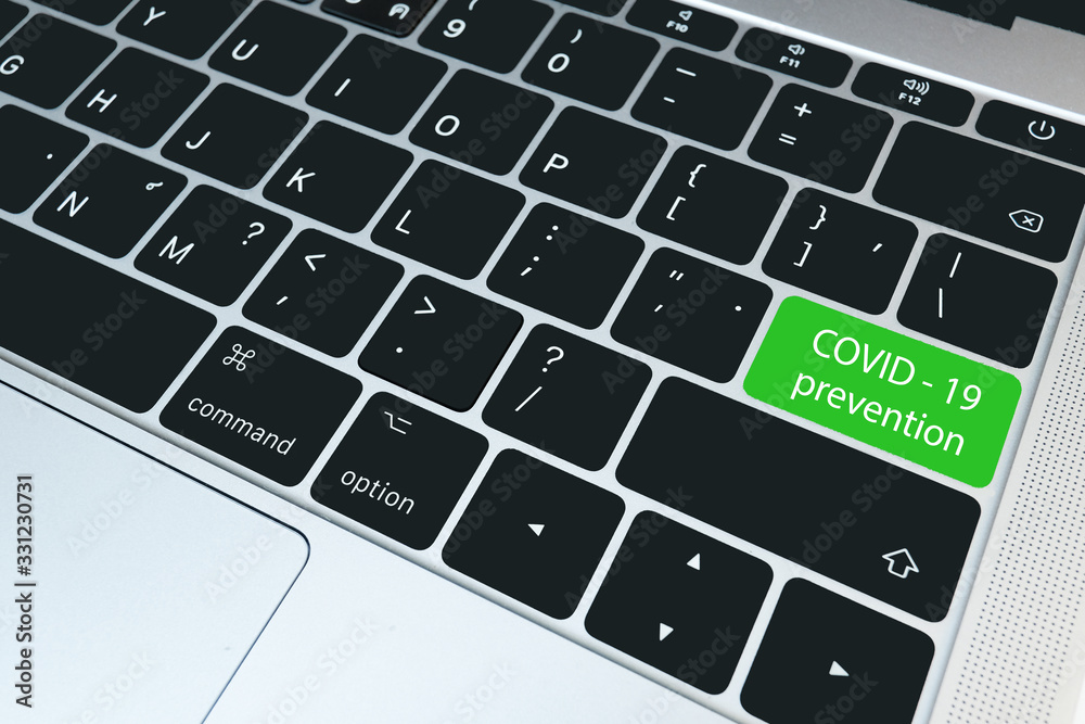 Closeup keyboard with green button-COVID-19 Prevention, Medical and technology concept Closeup keyboard with green button-COVID-19 Prevention, Medical and technology concept