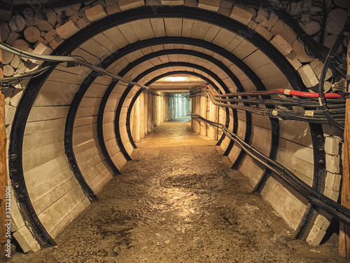 Wooden corridor with door in the salt mining caves © bzzup