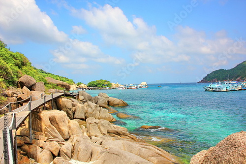 big and small shape brown rock on beach with sea landscape nature background,copyspace.