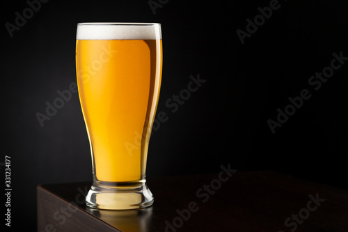 Cold light beer in beer glass