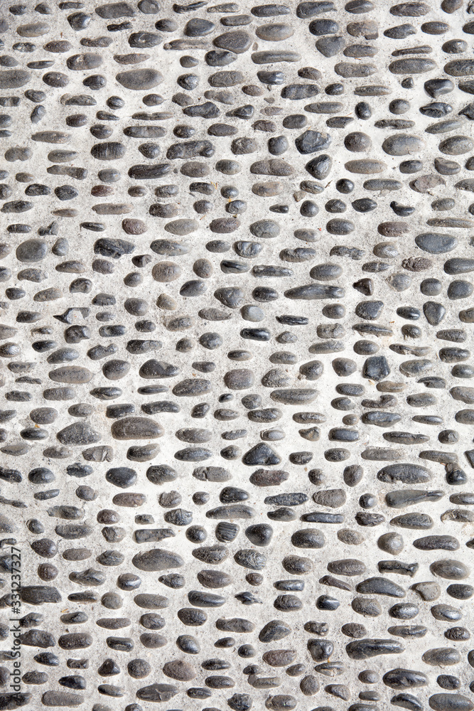 Cobbled pavement made of rounded pebbles Cobbled pavement made of rounded pebbles