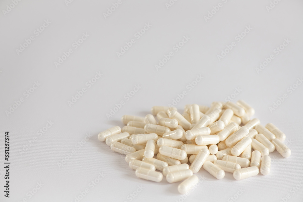 white pills with white powder close-up top view