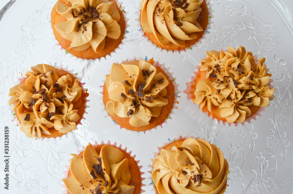 custom made wallpaper toronto digitalthe bun with cream. delicious cupcake. delicious cake with air cream and nuts on a white background. home-made pastry.