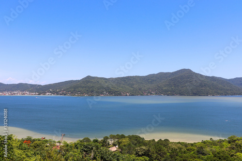 The beautiful panoramic view from the Mole beach viewpoint in Florianópolis, Santa Catarina.