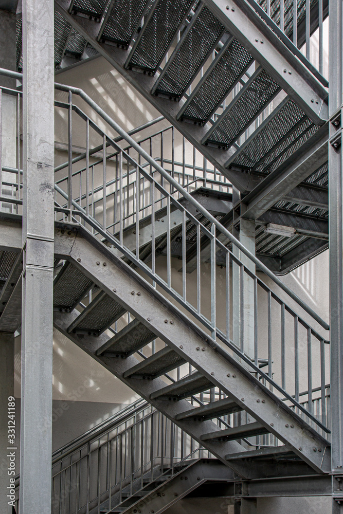 Metal staircase in a modern design outside a building