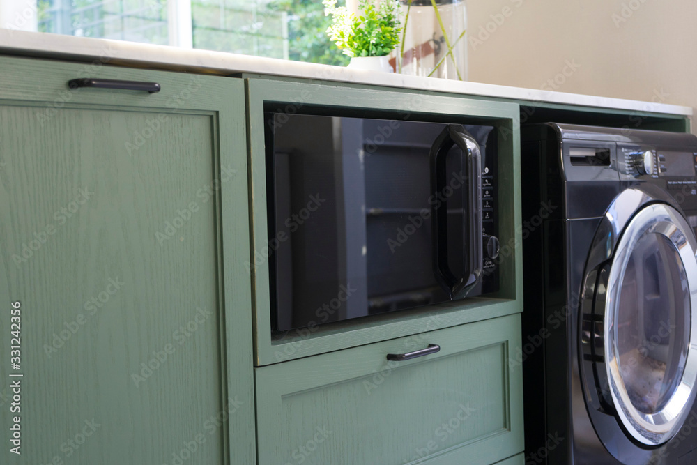 modern and new washing machine  in the kitchen counter.