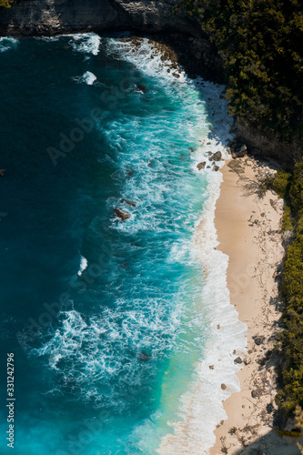 Amazing panoramic view of tropical beach, sea rocks and turquoise ocean, blue sky. Atuh beach, Nusa Penida island, island of Bali, Indonesia. Travel concept. Manta Bay or Kelkinkin Beach