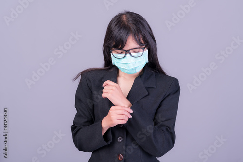 Asian business women have to use a mask to cover the face to prevent pollution from dust