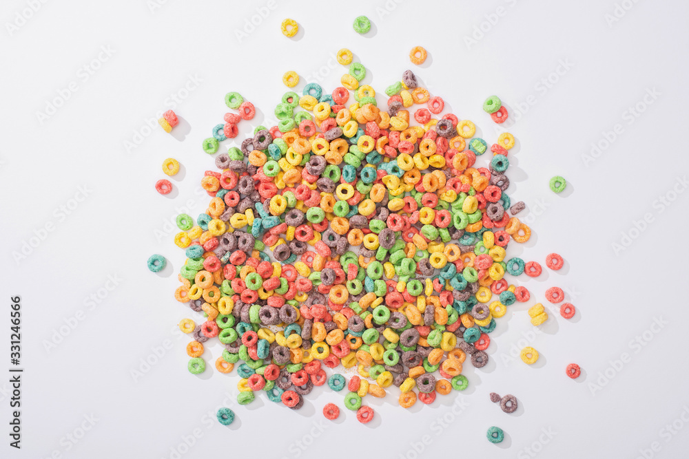 top view of bright multicolored breakfast cereal on white background top view of bright multicolored breakfast cereal on white background
