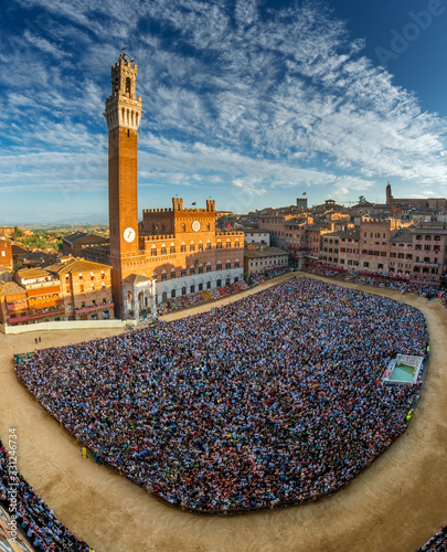 siena, piazza del campo full of people seen from the tower of palazzo sansedoni during the palio days photo
