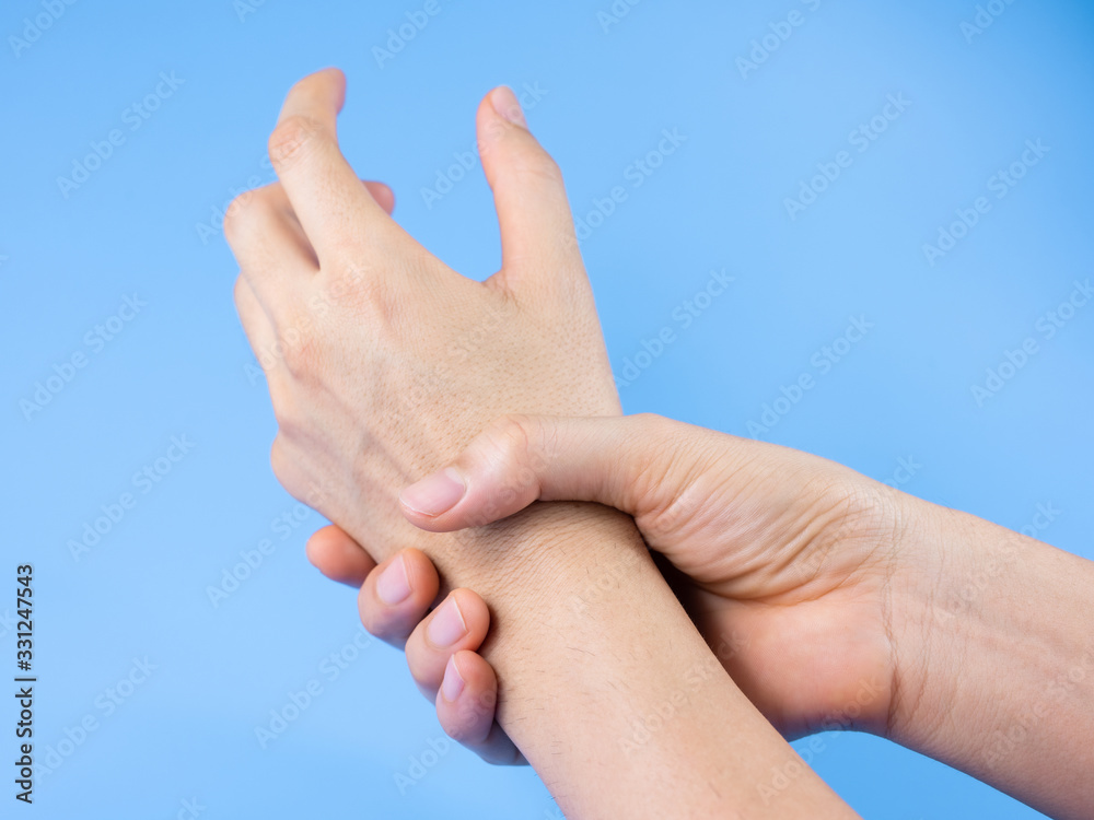 Man hands washing by sanitizer, alcohol gel for prevention corona virus, bacteria and germ on blue background, health care concept. Man hands washing by sanitizer, alcohol gel for prevention corona virus, bacteria and germ on blue background, health care concept.