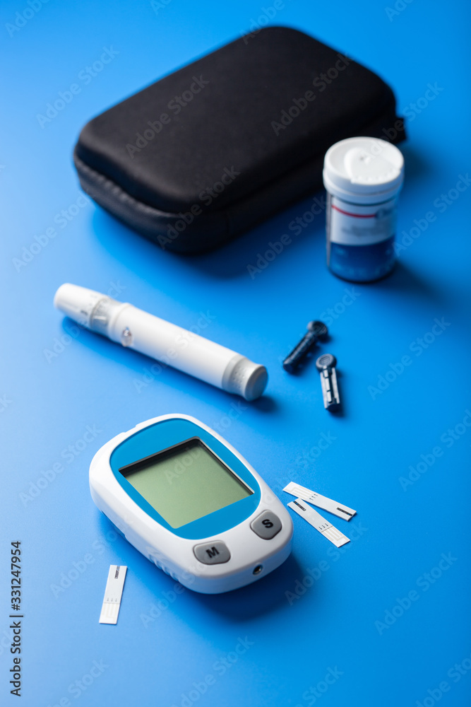 glucometer ketometer lancet and strips for self-monitoring of blood glucose or ketones level. diabetes or keto diet
