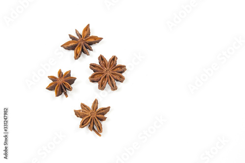 four stars of Badian in the left part of the image on a white background close up view from above