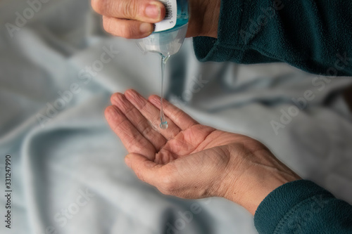 Squeezing out hand sanitiser