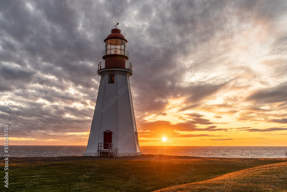 Point Riche, Port a Choix, Lighthouse as the sun setting into the Atlantic Ocean on the west coast of Newfoundland
