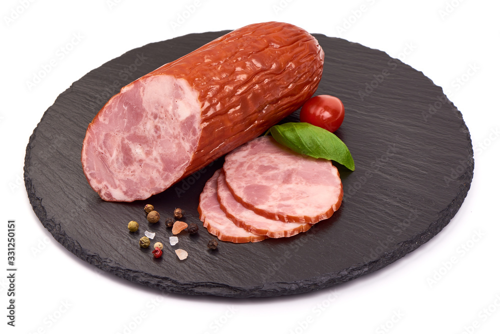 Smoked Ham sausage on a stone plate, isolated on white background