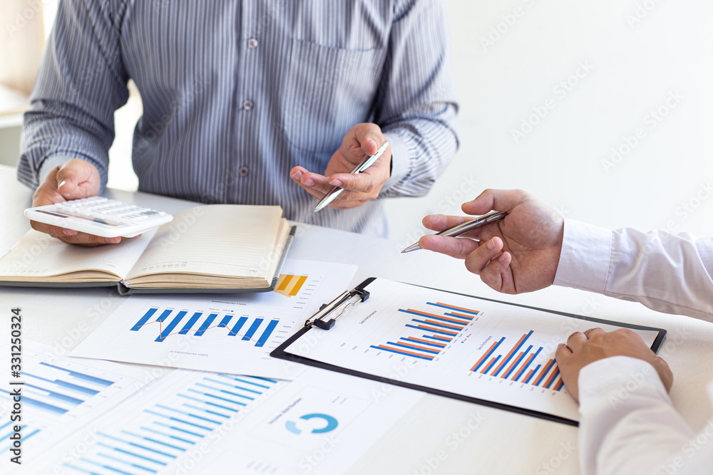 Business team meeting analyze financial graphs market growth reports And corporate income tax, Analysis of financial accounting and real estate investment concept.. Business team meeting analyze financial graphs market growth reports And corporate income tax, Analysis of financial accounting and real estate investment concept..