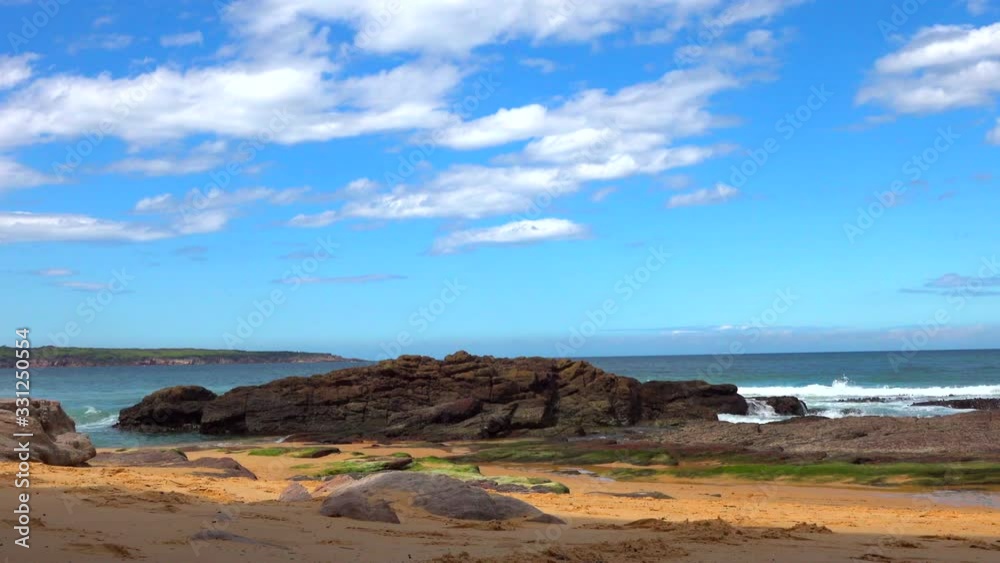 beach with cliffs and sea waves on a sunny day beach with cliffs and sea waves on a sunny day