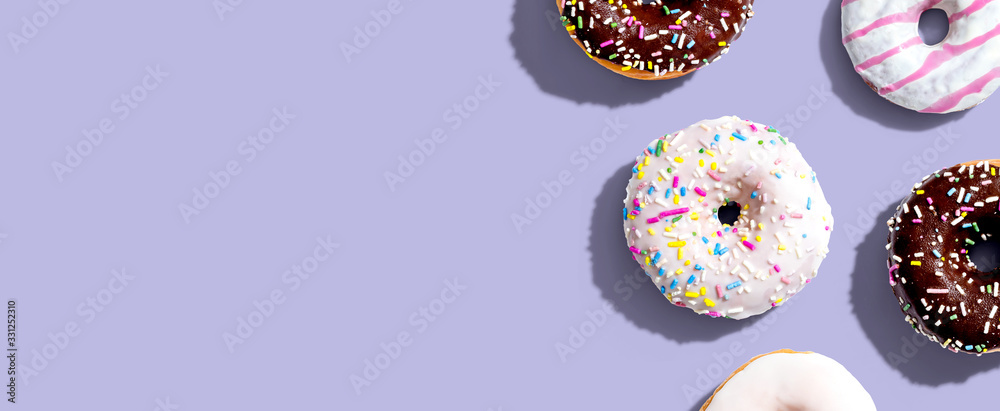 Collection of delicious donuts overhead view flat lay - obrazy, fototapety, plakaty 