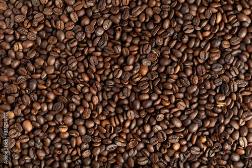  background texture of coffee beans top view. copyspace